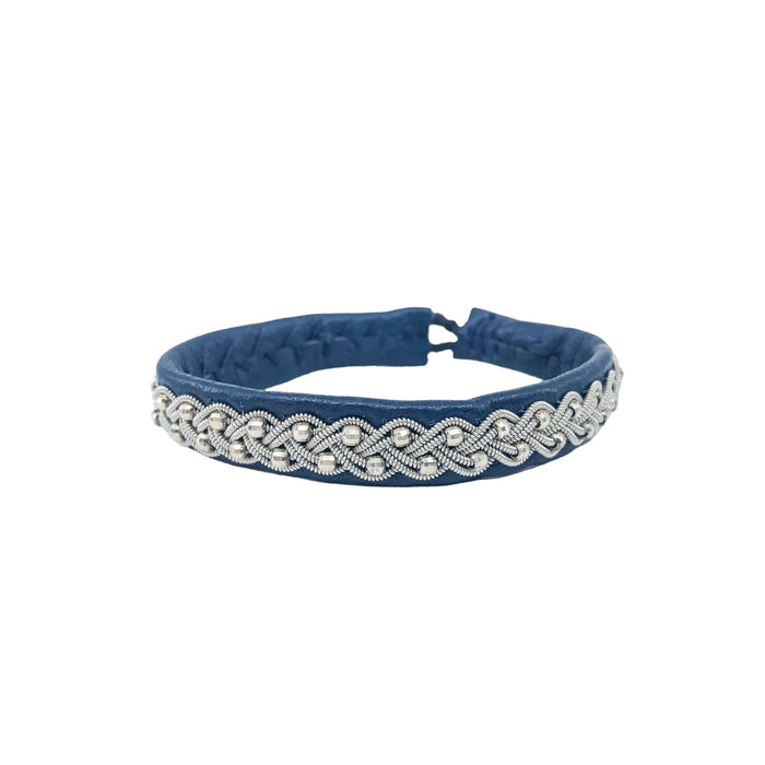 bracelet with silver beads and reindeer antler button. Elegant, feminine, Nordic design.